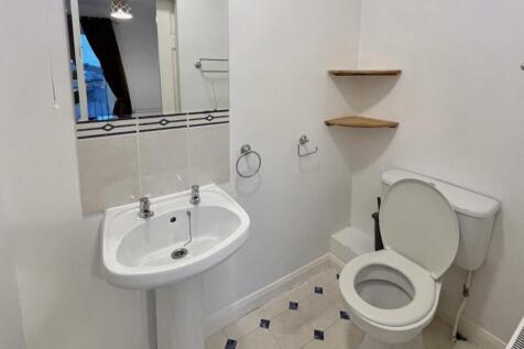 A clean and tidy bathroom featuring modern fixt...