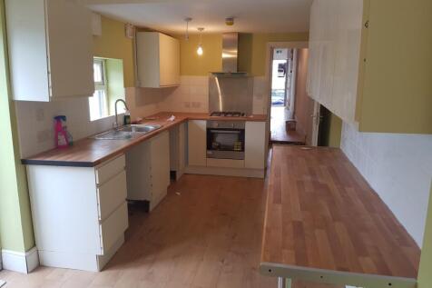 A spacious and tidy kitchenette with modern app...