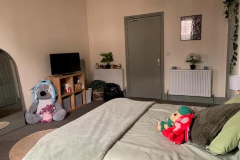 A bright and inviting double bedroom with ample...