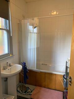 A clean and well-maintained bathroom featuring ...