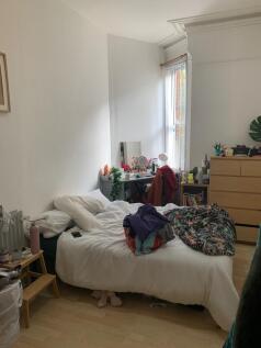 A cozy double bedroom filled with natural light...
