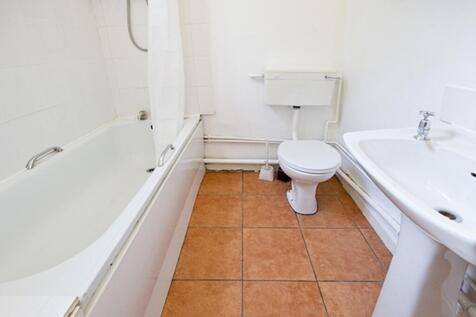 A clean and functional bathroom featuring a bat...