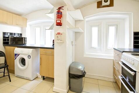 A bright and tidy kitchenette featuring modern ...