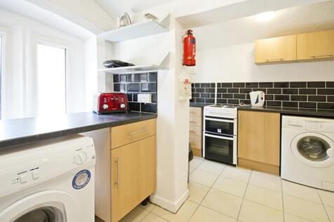 A bright and tidy kitchenette featuring modern ...