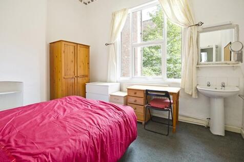 A bright and welcoming double bedroom featuring...