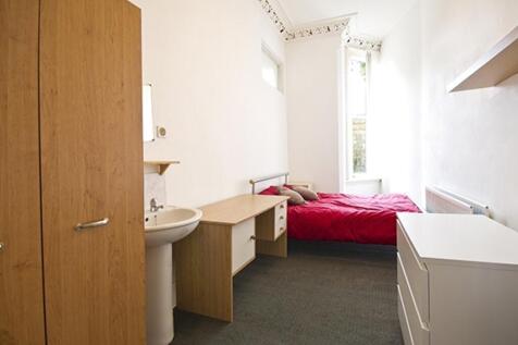 A bright and inviting double bedroom featuring ...