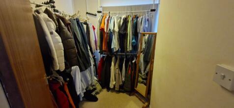 A compact storage area with ample hanging space...