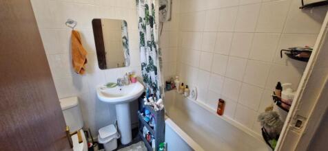 A functional bathroom with essential amenities,...