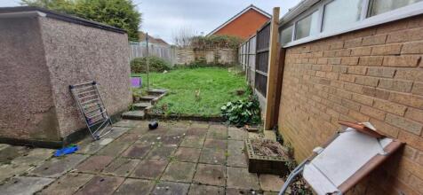 A spacious garden area with potential for outdo...