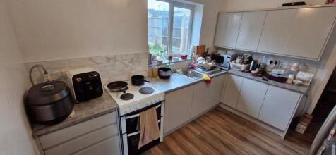 A functional kitchenette with ample storage and...