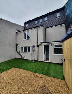 A spacious and well-maintained garden area feat...