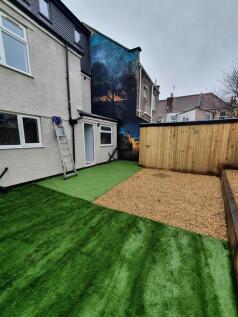 This charming garden features a well-maintained...