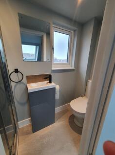 This stylish bathroom features modern fixtures ...