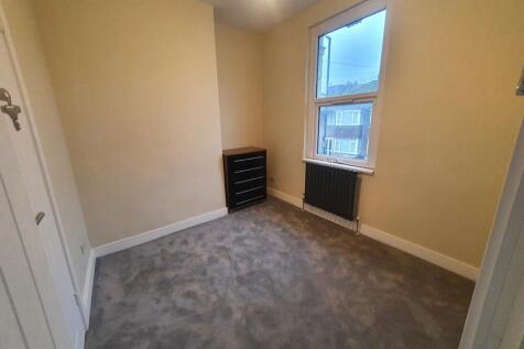 Bright and cozy double bedroom featuring a styl...