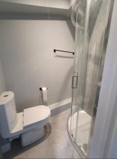Modern bathroom featuring a sleek shower and co...
