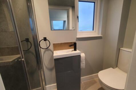 A modern bathroom featuring a sleek design with...