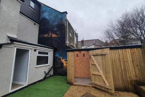 A charming garden space featuring a well-mainta...