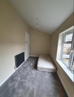 Bright and spacious double bedroom featuring la...