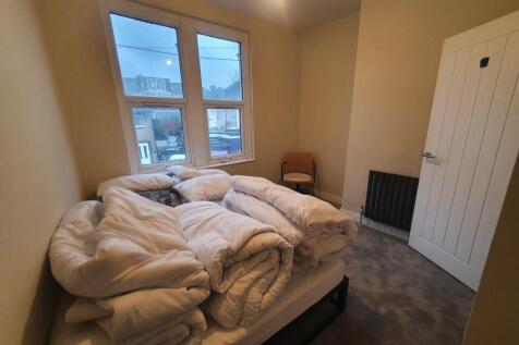 This inviting double bedroom features ample nat...