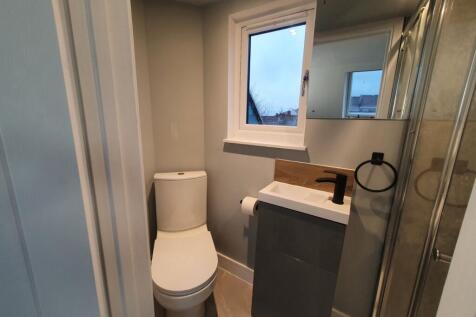 This modern bathroom features a sleek design wi...