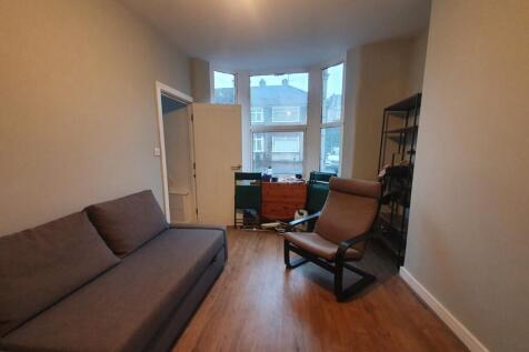 Bright and inviting living room featuring a com...