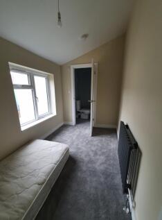 This inviting double bedroom features ample nat...