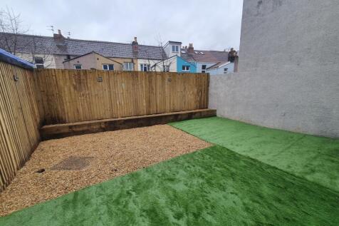 A charming garden area featuring a well-maintai...