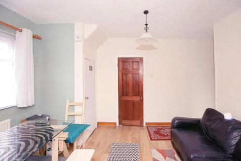 A bright and inviting living room with a cozy a...