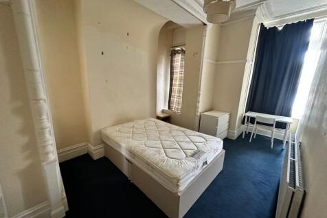 A spacious and bright double bedroom with ample...