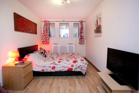 A bright and inviting double bedroom featuring ...