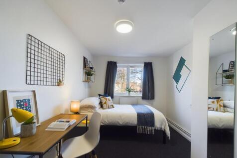 A bright and inviting double bedroom featuring ...
