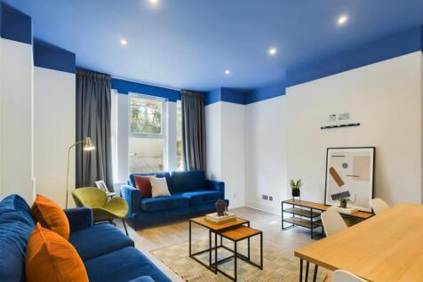 A spacious and stylish modern living room with ...