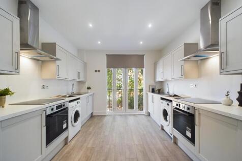 A spacious and modern kitchen, featuring ample ...