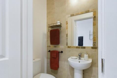 A modern and clean bathroom featuring stylish d...