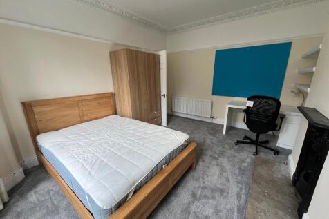 A spacious and inviting double bedroom featurin...