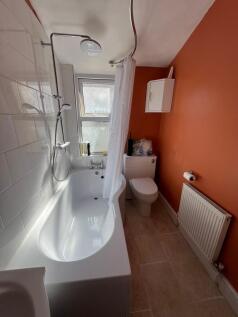 A bright and clean bathroom featuring a modern ...