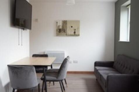 A modern and inviting living room featuring sty...
