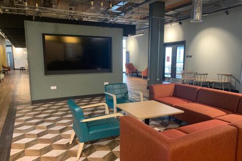 A spacious and inviting communal lounge with a ...