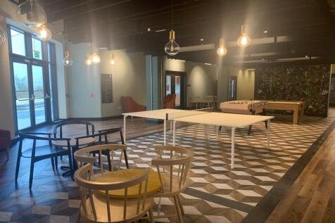 An inviting and spacious communal lounge area p...