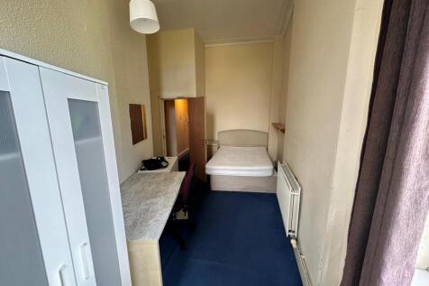 A bright and spacious double bedroom featuring ...