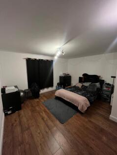 A spacious and inviting double bedroom featurin...
