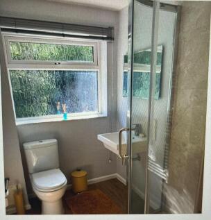 A bright and modern bathroom featuring a stylis...