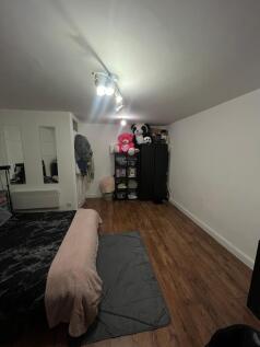 A cozy double bedroom featuring ample storage a...