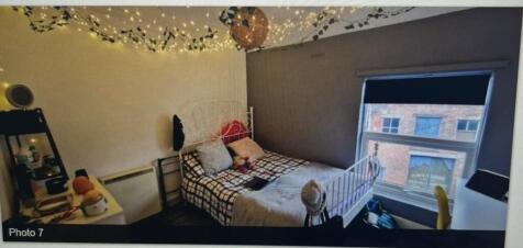 A cozy and inviting double bedroom adorned with...