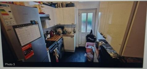 A compact and functional kitchenette with moder...