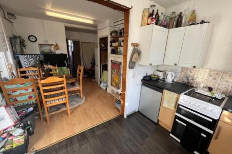 A cozy and inviting kitchenette with dining spa...