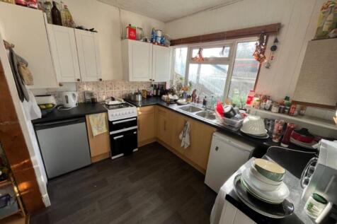 A cozy and functional kitchen with ample storag...