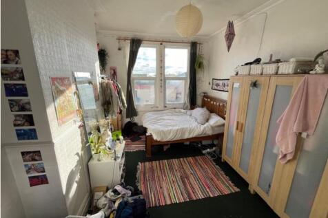 A cozy double bedroom with ample natural light ...