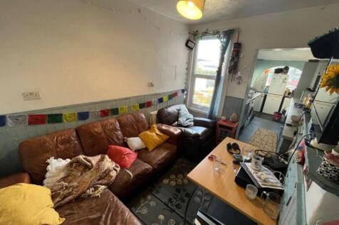 A cozy living room featuring comfortable seatin...