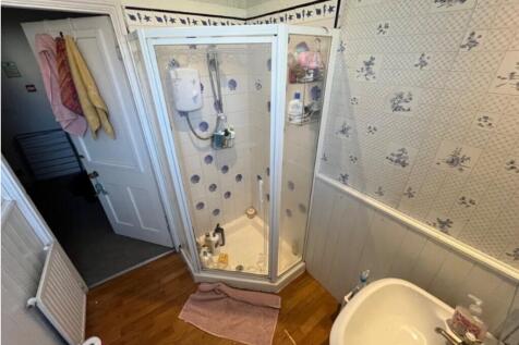 A tidy bathroom featuring a shower and stylish ...